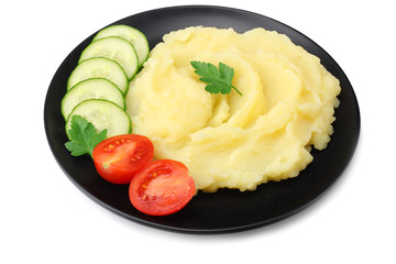 Mashed potatoes on black plate isolated on white background.