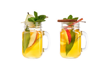 Two lemonade on a white background. A refreshing drink with pear and apple juice.