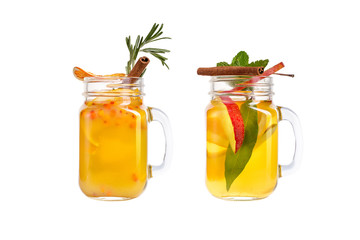 Two lemonade on a white background. Refreshing drinks with berries and sea buckthorn juice.