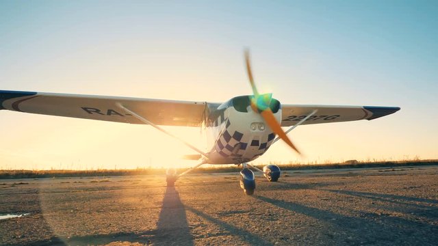 Plane with rotating propeller, close up.
