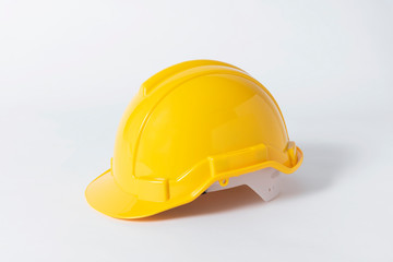 Fototapeta premium Plastic safety helmet for engineer on gray background.