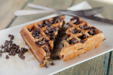 Chocolate chip waffle cut into half