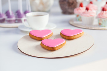 pink hearts cookies on a white plate