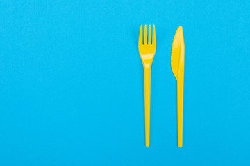 Colorful set of vibrant forks and knife isolated on black