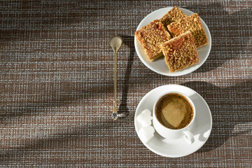Coffee and cake in the cafe on a Sunny morning