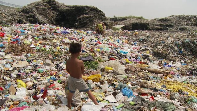 Waste pickers at garbage dump in Manila Philippines