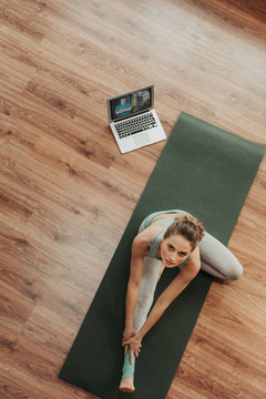 Woman Doing Head To Knee Yoga Pose