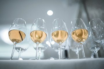 row of glasses with wine