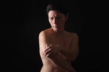middle-aged woman with shoulder pain