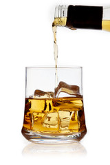 Glass of whiskey with ice cubes (on the rocks) isolated on white background