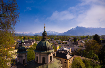 Fototapeta na wymiar Beautiful of Aerial panoramic view at a historic city of Salzburg with Salzach river in beautiful golden evening light with blue sky and clouds at sunset in summer, Salzburger Land, Austria