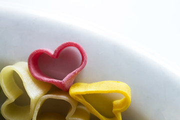 pasta in the form of hearts, different colors, before cooking