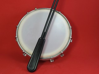 Tamborim and drumstick: a Brazilian percussion musical instrument. It is used to play samba, the famous Brazilian rhythm and has great prominence in the parades of samba schools, in the carnival.