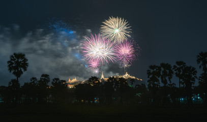 Annual festival of Khao Wang temple with colorful fireworks on hill at night