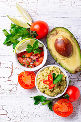 Guacamole and  tomato sauce salsa