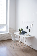 Fototapeta na wymiar Stylish white professional office interior, minimalist loft workspace
