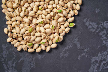 Pistachios  on black table ,with copy space ,Top view