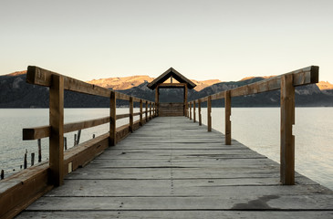 Obraz premium wooden pier on the lake river autumm winter travel place quiet peace