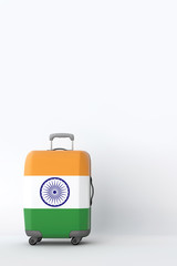 Travel suitcase with the flag of India. Holiday destination. 3D Render