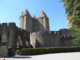 Fototapeta na wymiar The stone walls of the ancient city of Carcassonne, a UNESCO heritage site, in France, on a clear Sunny day.