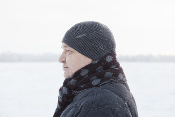 Aged man in winter field