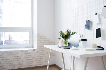 Fototapeta na wymiar Stylish white professional office interior, minimalist loft workspace