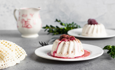 Cottage cheese dessert (jelly or panna cotta) with cherry sauce and cocoa. Healthy breakfast or dessert.  