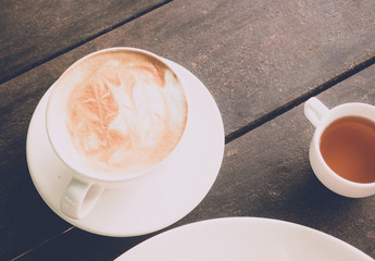 Hot coffee ready to drink on wood table background