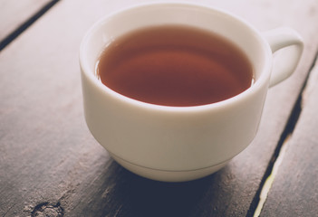 Hot tea serving on wood table background with soft light morning