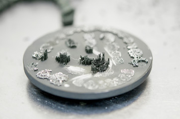 Disk after cutting tooth dental crowns created on 3d printer for metal