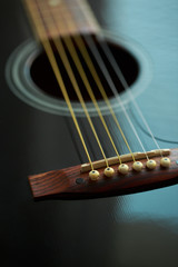 Strings of acoustic guitar