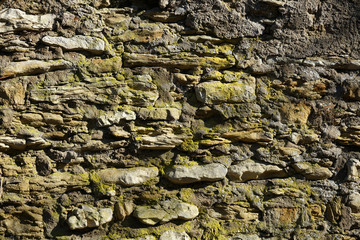 Natural stone wall lovingly bricked or misplaced photographed in a park in Germany 