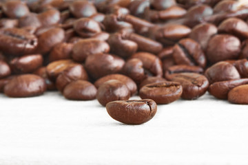 The coffee beans with shadows isolated on white background