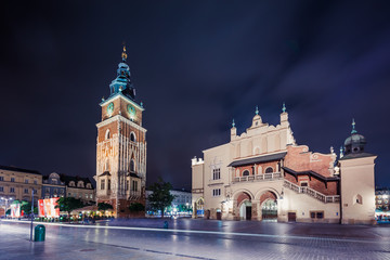 Fototapeta na wymiar Krakow Cloth Hall and Town Hall Tower at night , Poland