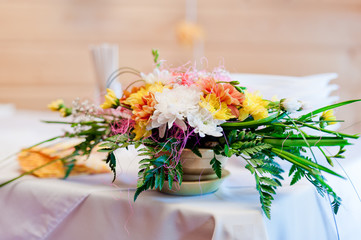 decoration of wedding table with flowers in a pot