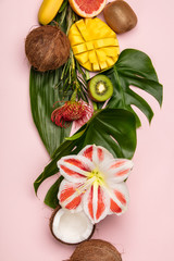Creative flat lay with tropical fruits and plants