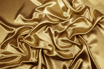 Gold luxury satin fabric texture for background