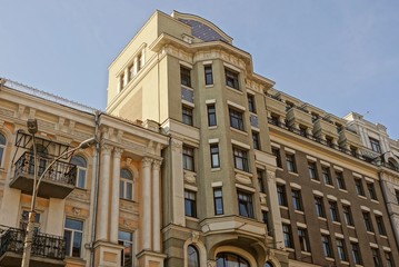 brown houses with lots of windows and balconies against the sky