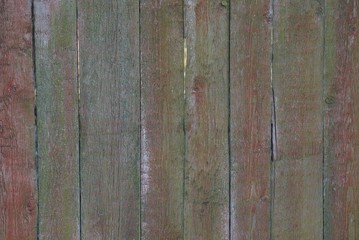 colored wooden texture of old boards in the wall of the fence