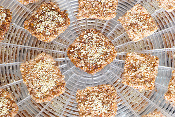 Vegan cookies are preparing on the dehydrator grid