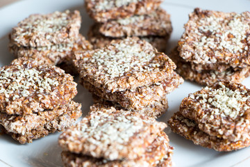 Vegan cookies from wheat and raisins on plate. Top angle view.