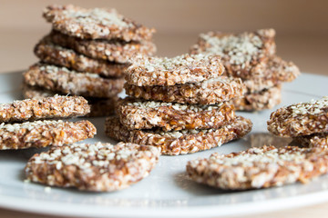 Vegan cookies from wheat and raisins on white plate