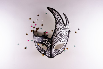 Carnival Venetian mask on white background with confetti. Carnival Brazilian, Venice party.