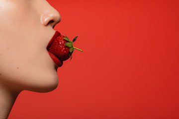 Eating a fresh strawberry