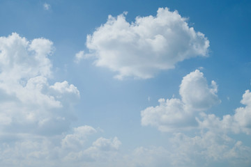 fluffy white cloud on clear blue sky