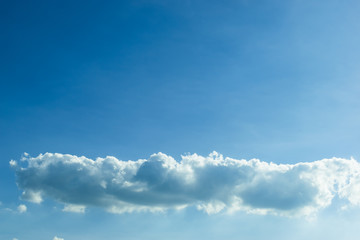 fluffy cloud above clear blue sky