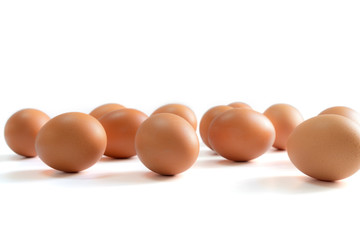 Eggs spread ramdomly on the white background