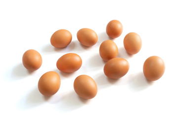 Eggs spread ramdomly on the white background