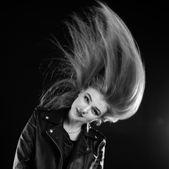 portrait of a young girl with flowing hair in the studio