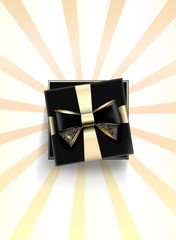 Decorative black gift box with golden bow and long ribbon. Vector